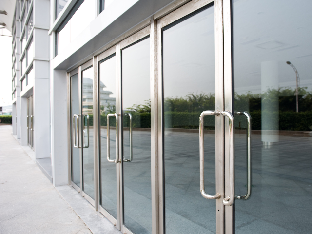 Modern glass doors with metal handles