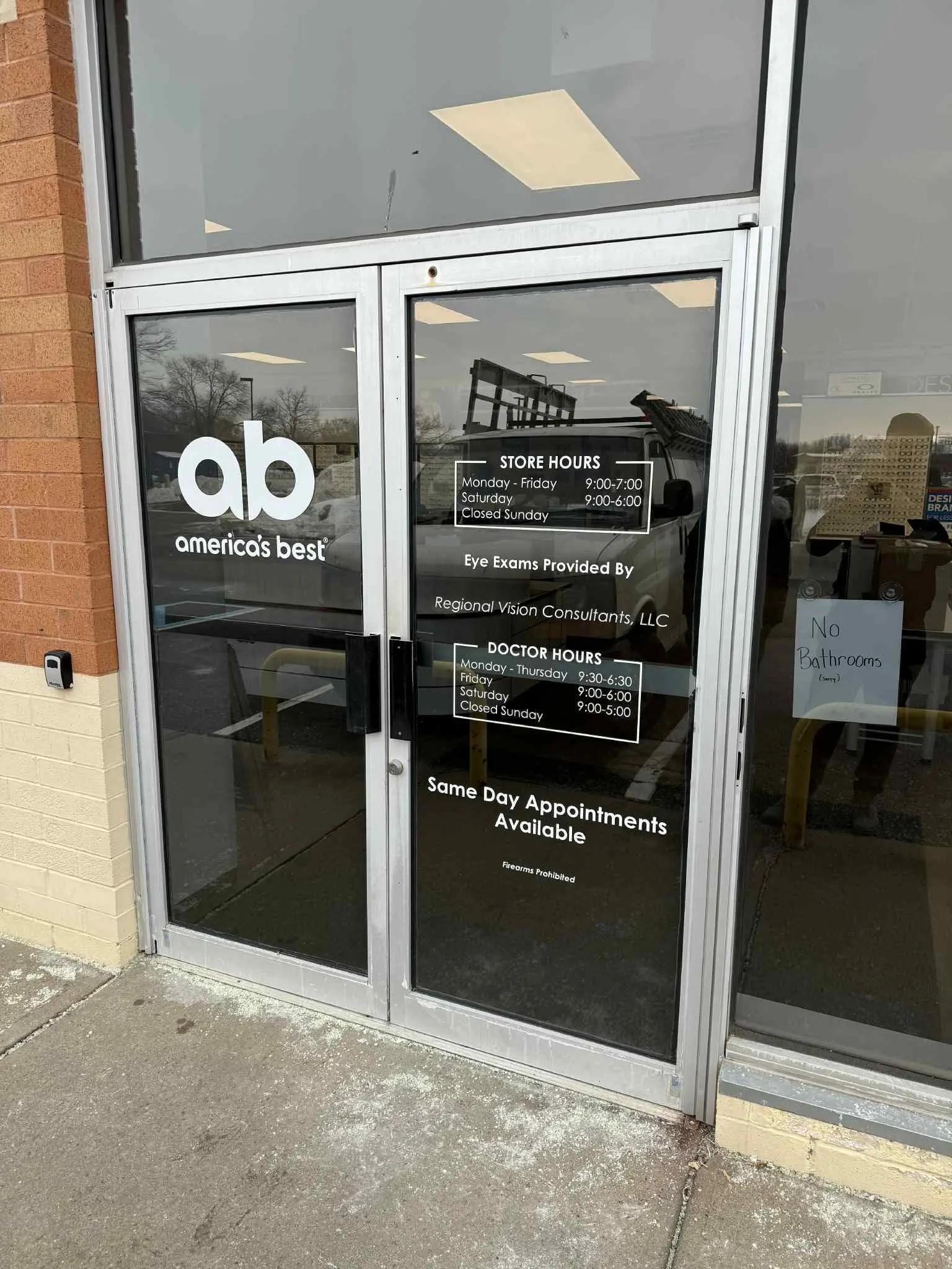 Aluminum storefront door after repair and glass replacement