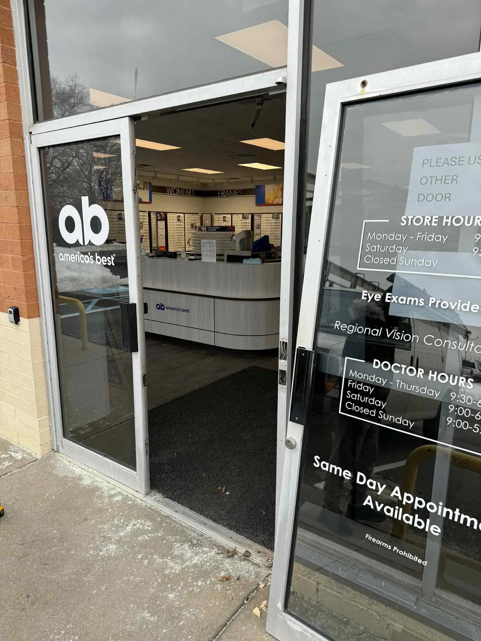 Damaged aluminum storefront door before repair, Alexandria VA
